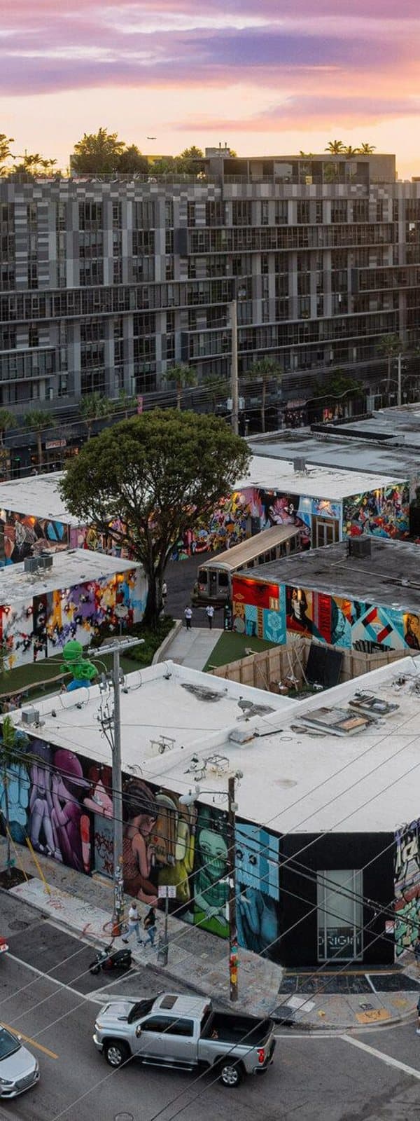 Murals across the warehouse rooftops of Wynwood at sunset