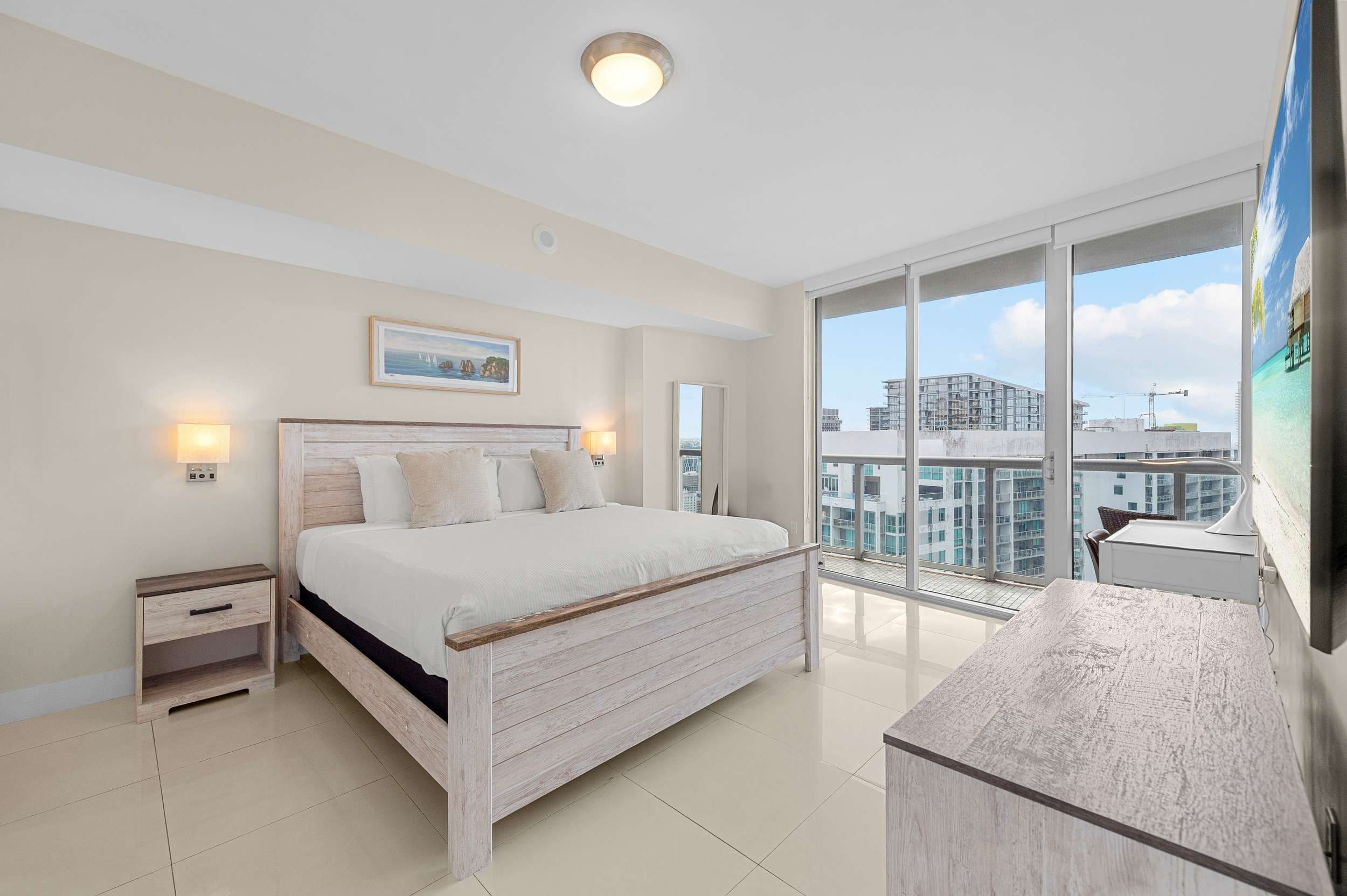 Sun-drenched master bedroom with direct access to the private terrace.