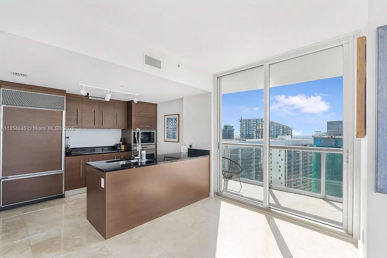 Fully equipped chef’s kitchen featuring seamless city backdrops.