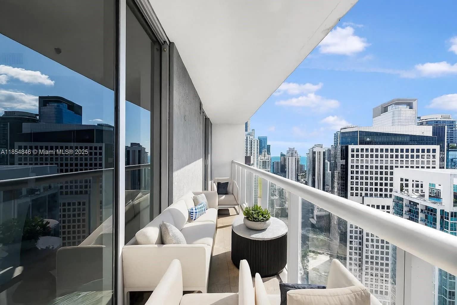 Private high-rise balcony, perfect for morning coffee over the city.