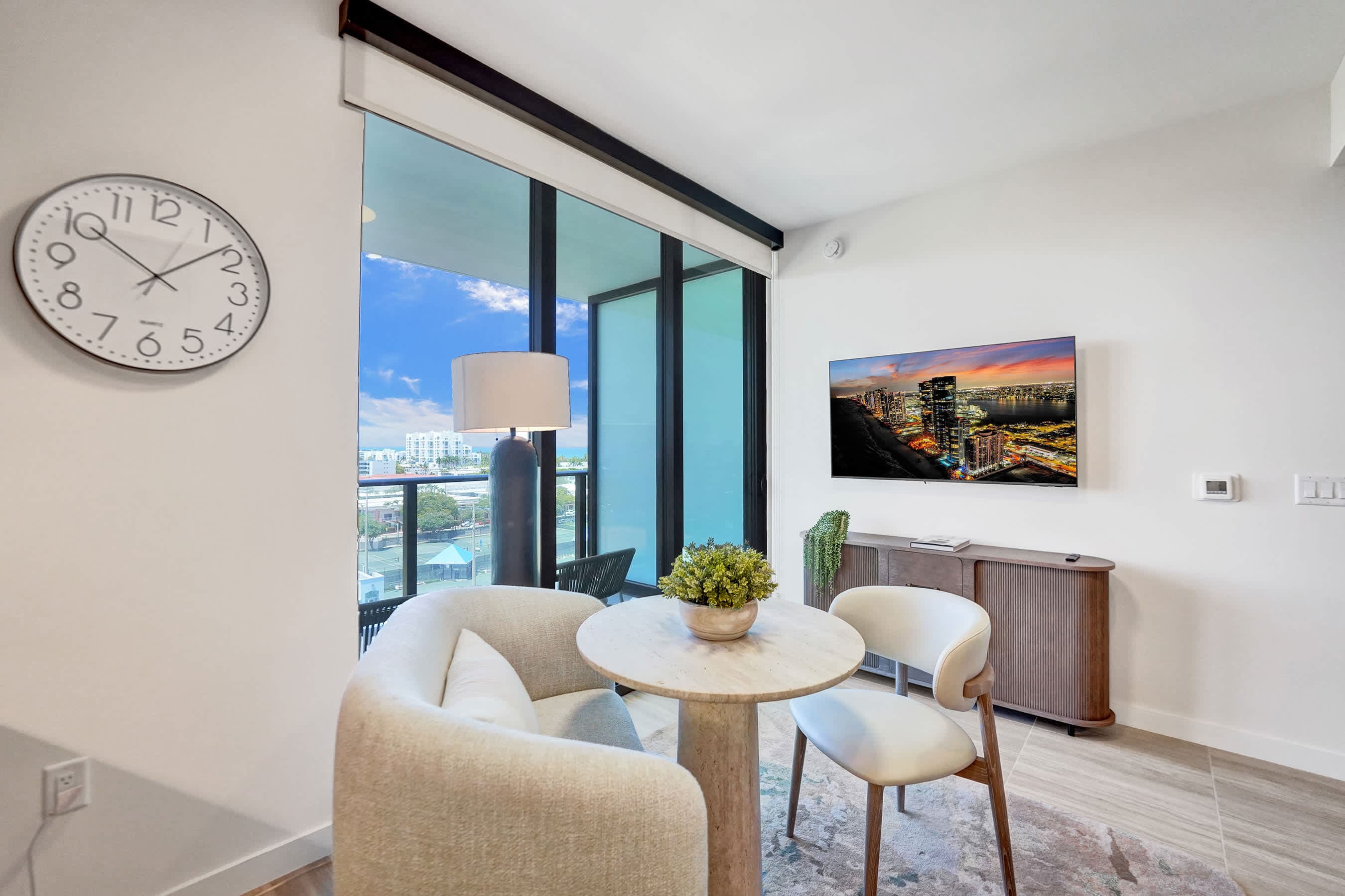 Sunlit, modern living corner overlooking the city.