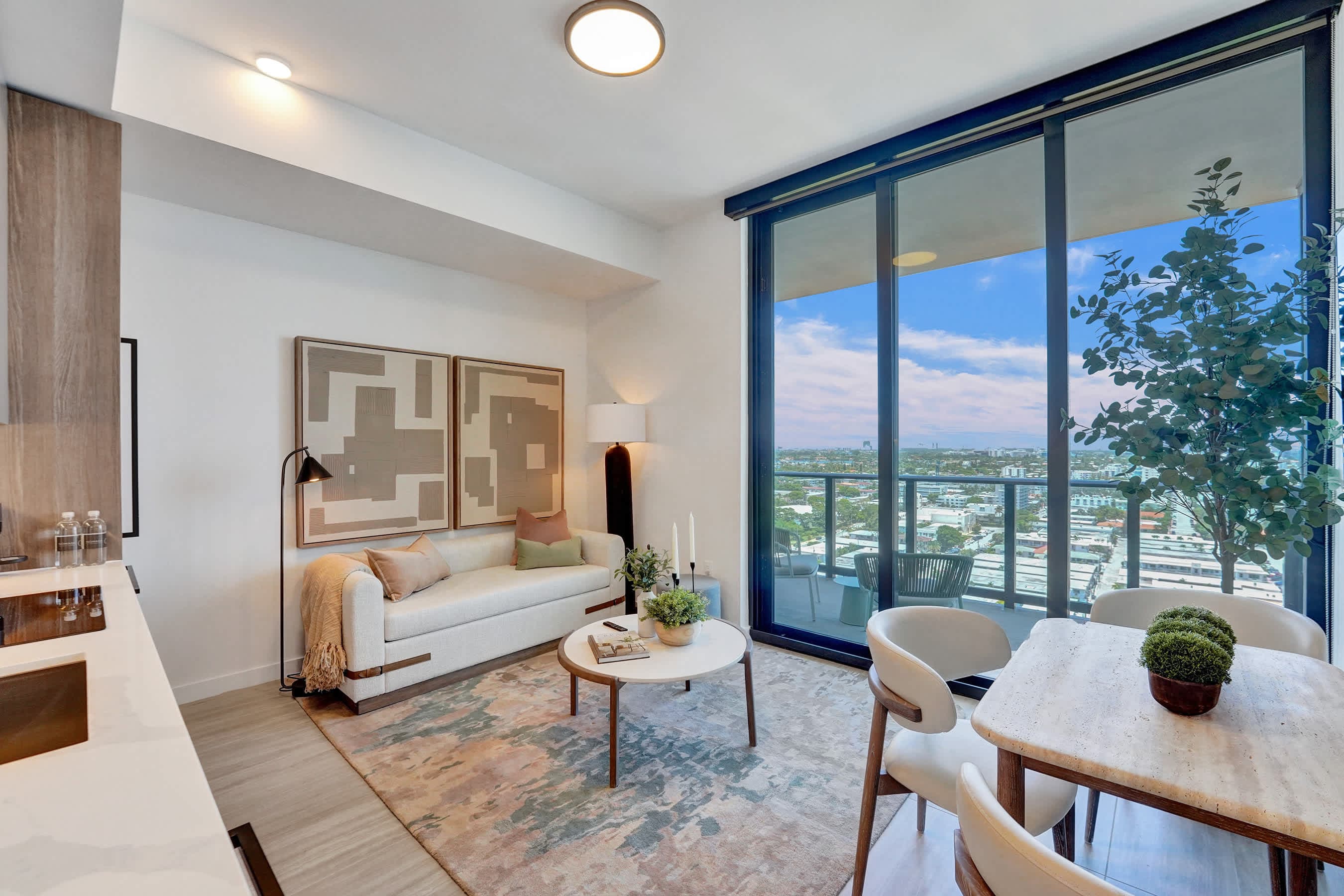 Sun-drenched modern living area with floor-to-ceiling views