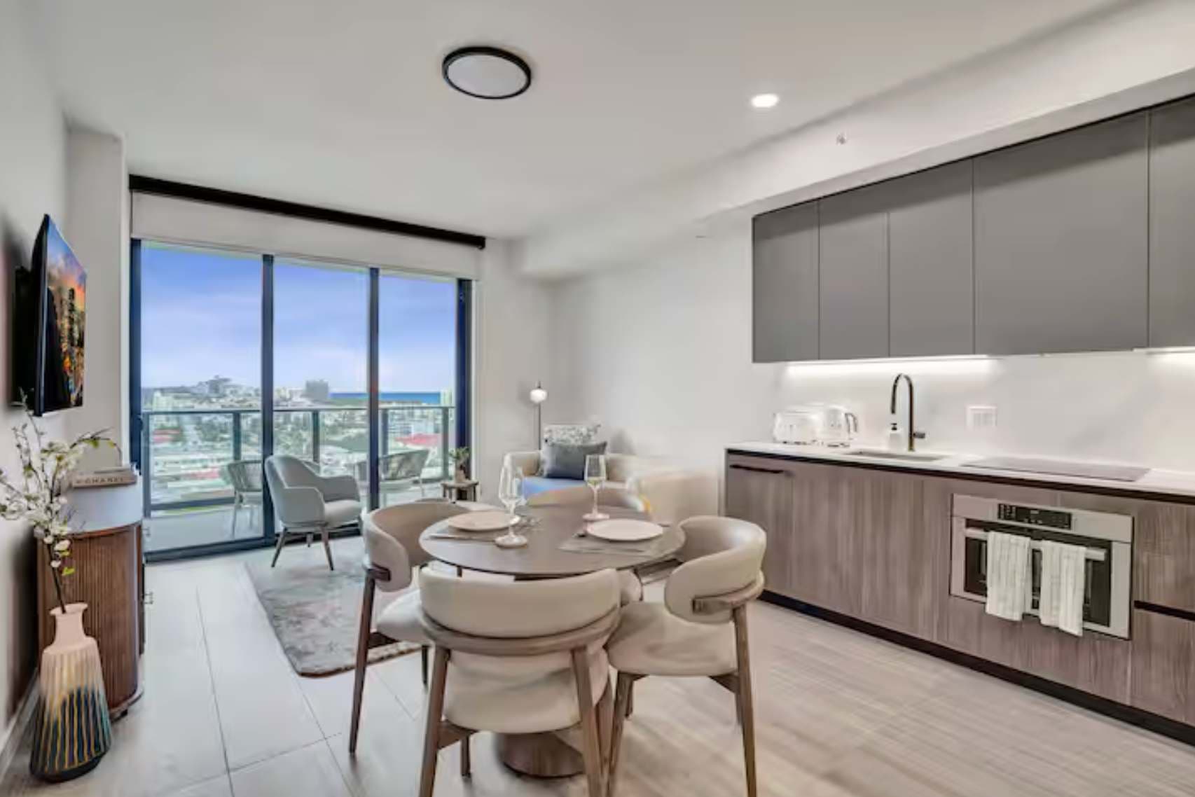 Sleek, open-concept dining space with floor-to-ceiling views.