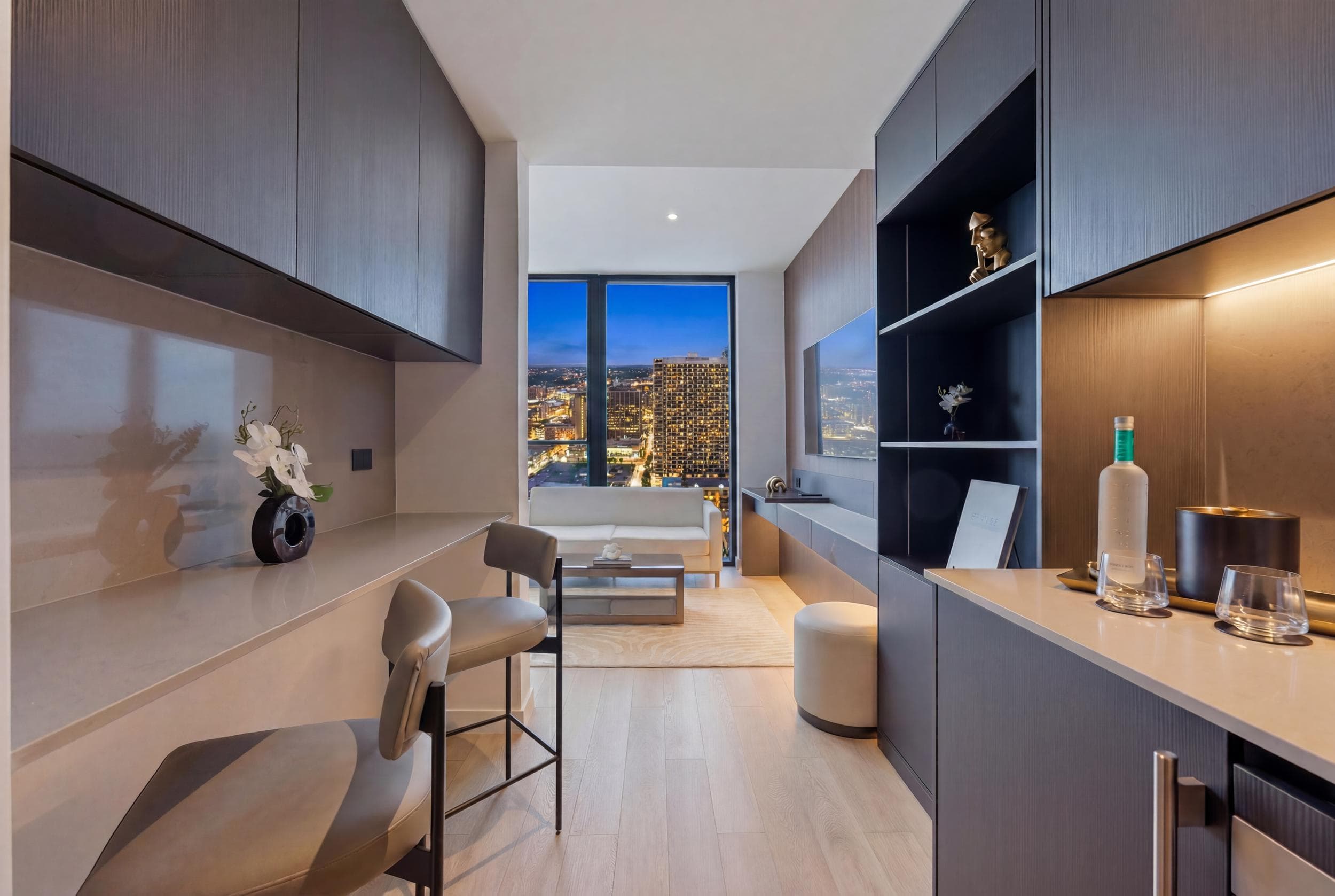 Sleek modern workspace with floor-to-ceiling window views.