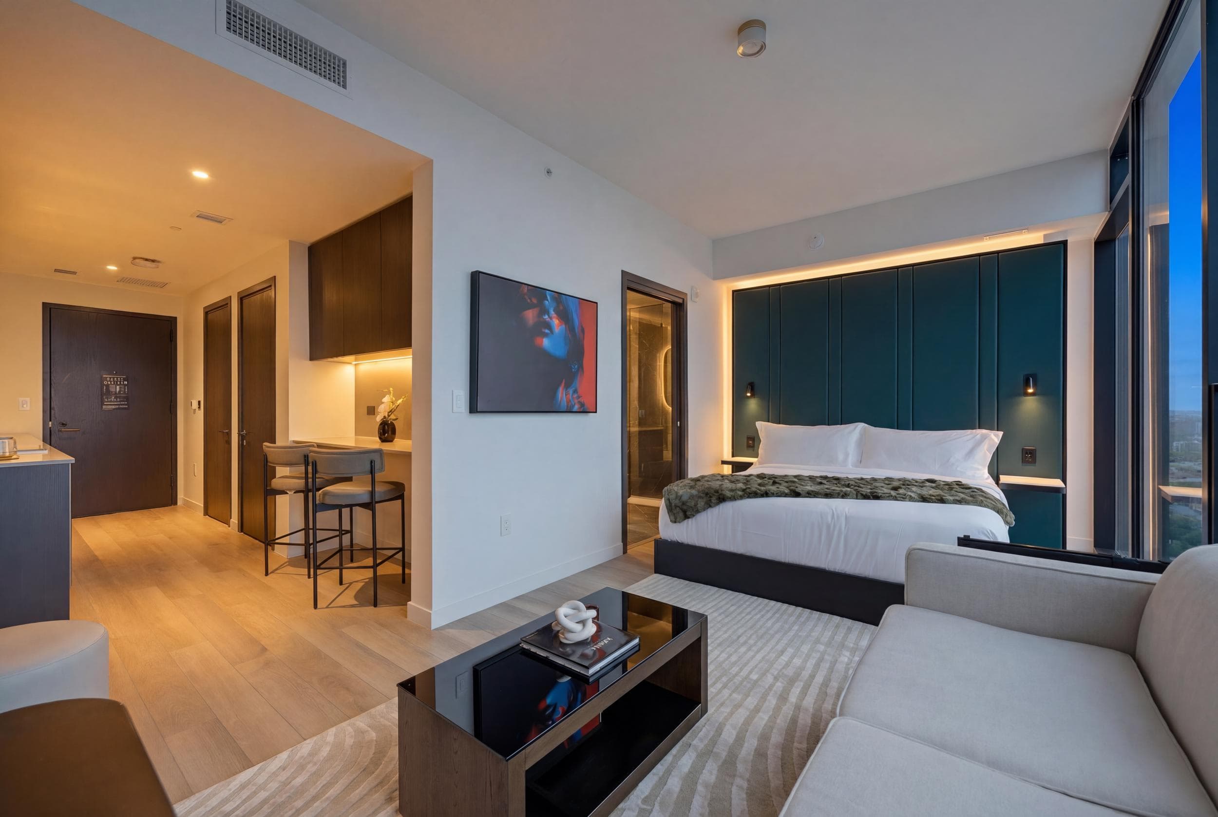Elegant dark-toned bedroom with plush bedding and style.