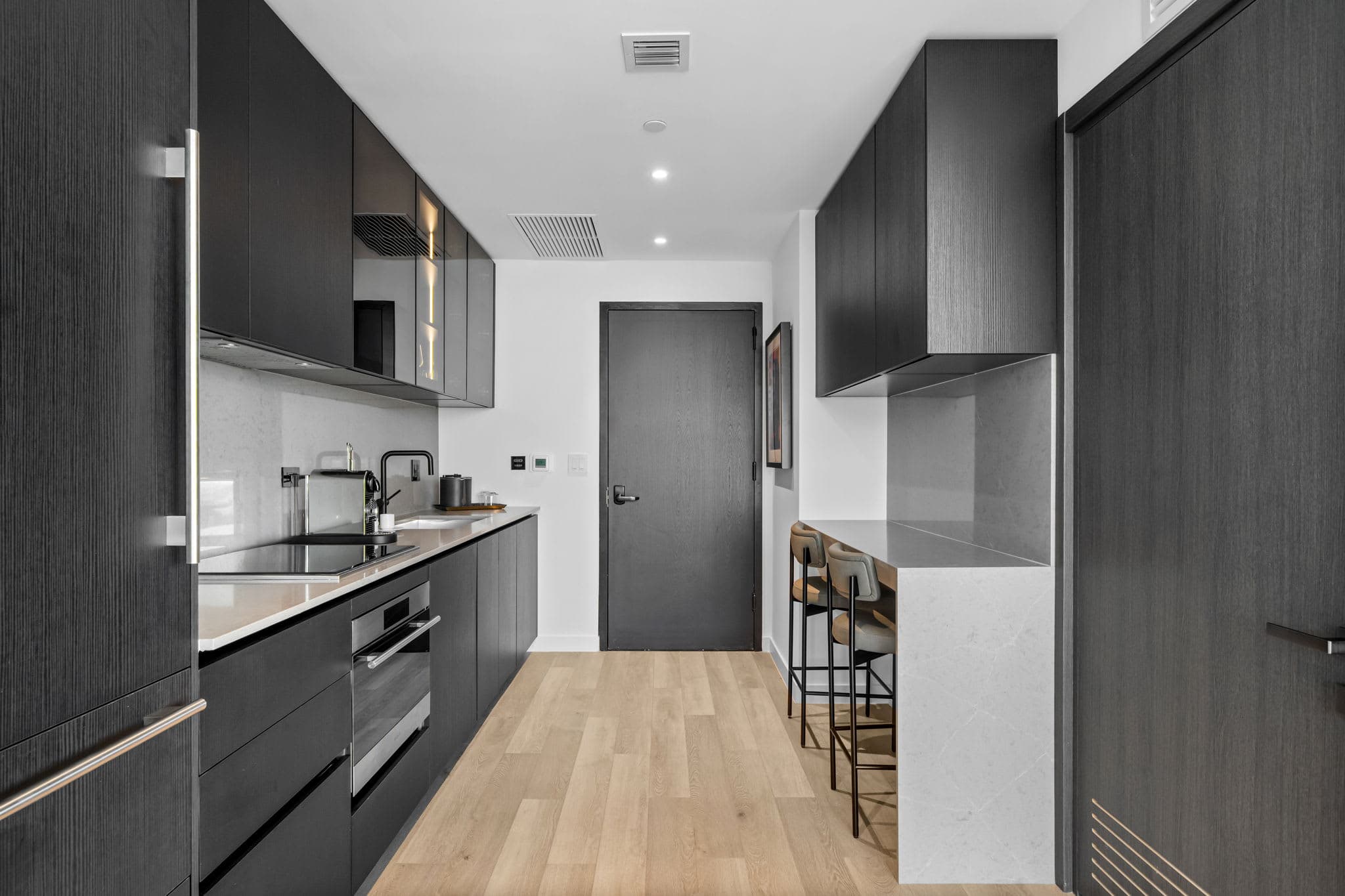 Kitchen counter beside the apartment entrance.