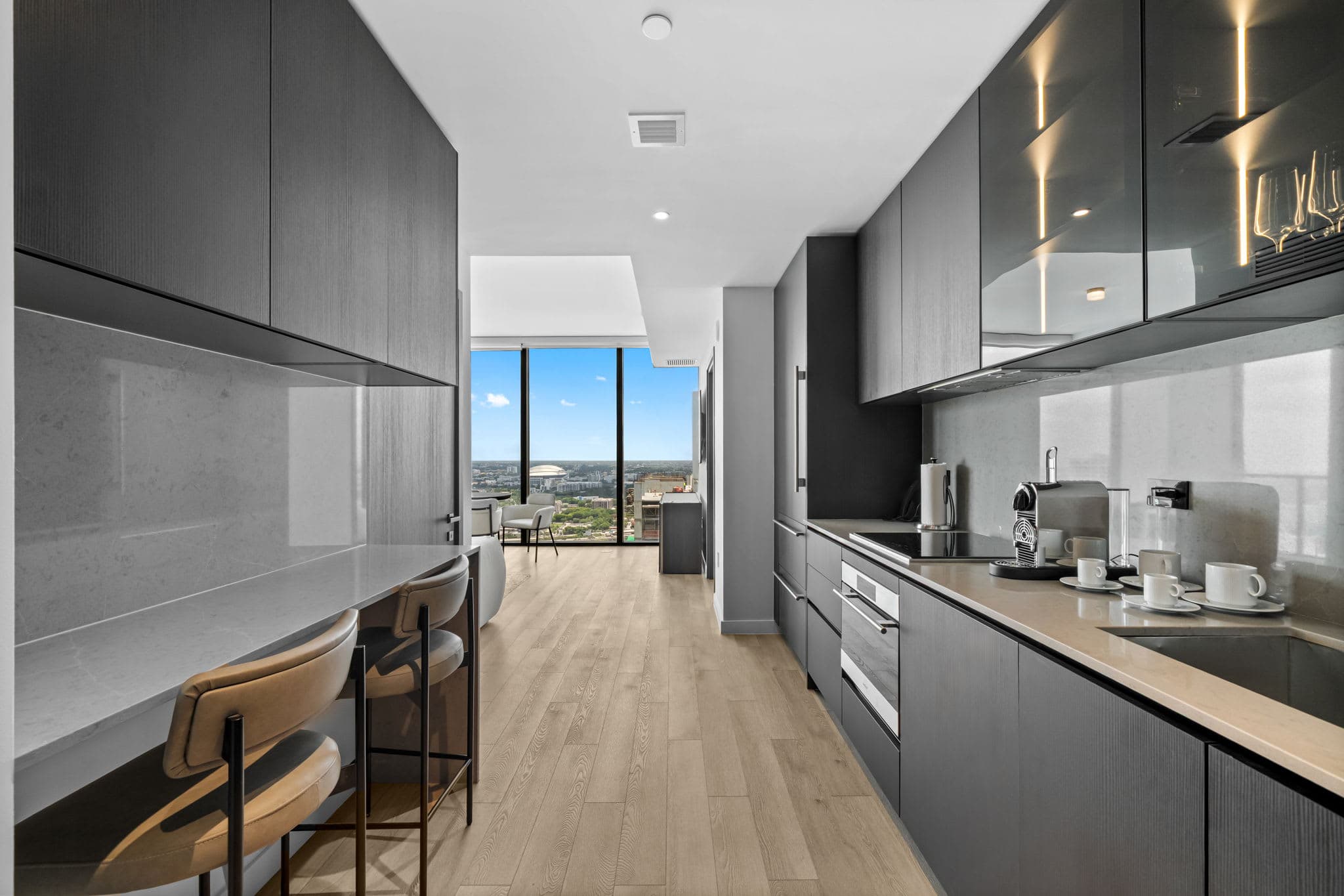 Galley kitchen with a breakfast bar.