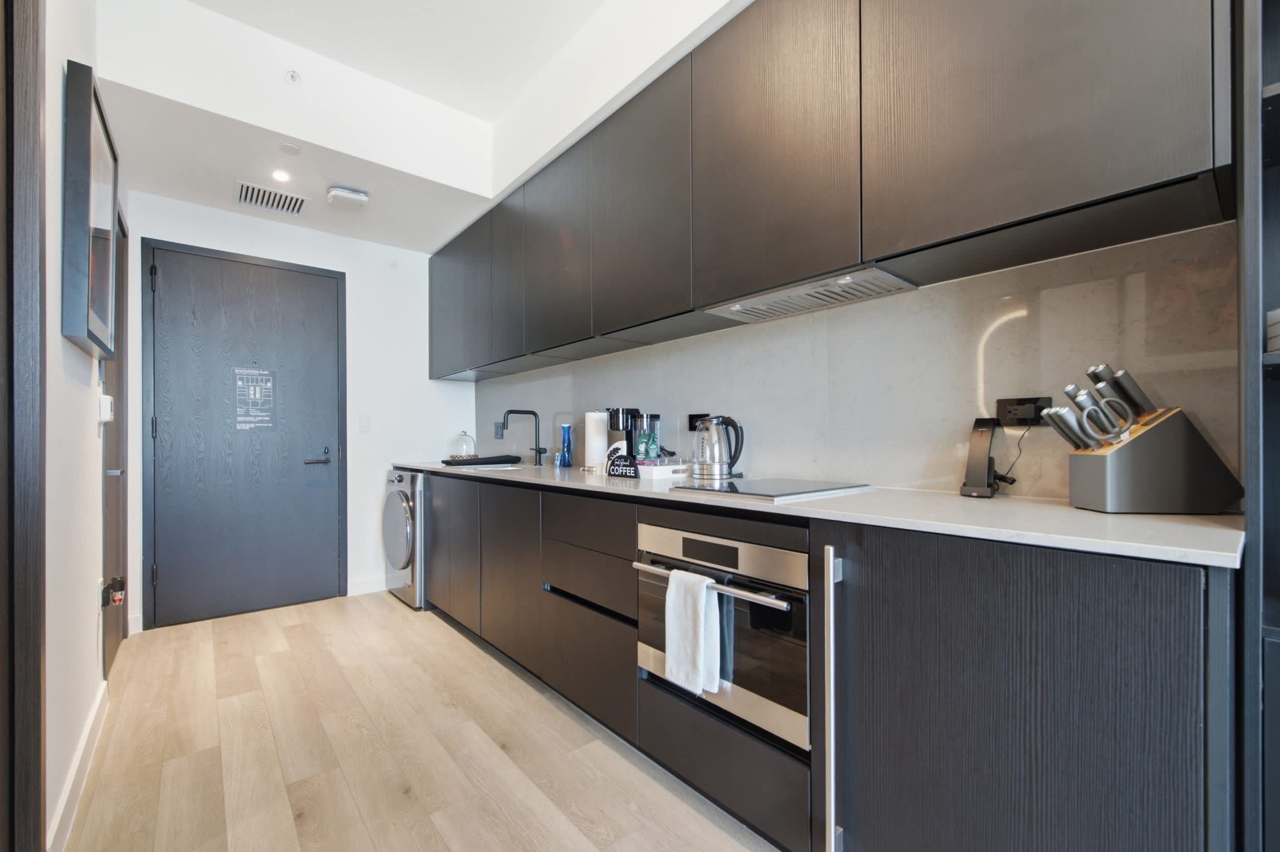 Kitchen counter beside the apartment entrance.