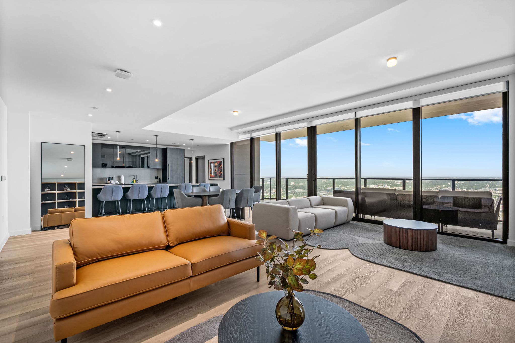 Living room with an orange sofa and display shelving.